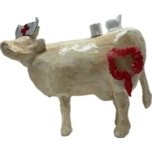 Coloscopie. Une Vache décorative décorée avec un colon, papier toilette et seringue