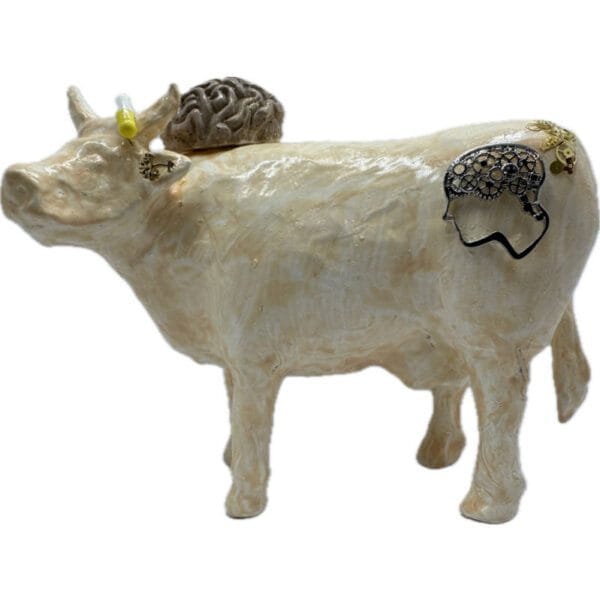 Psycho. Une Vache décorative décorée avec un cerveau, des rouages et des neurones